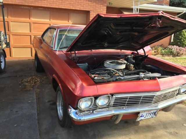 1965 red Chevrolet Impala Coupe