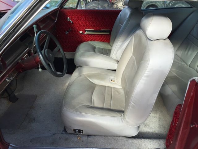 1965 red Chevrolet Impala Coupe