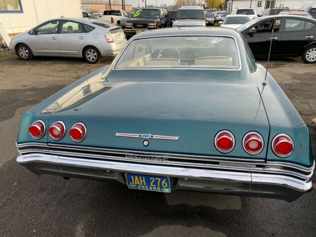 1965 Teal Chevrolet Impala Coupe