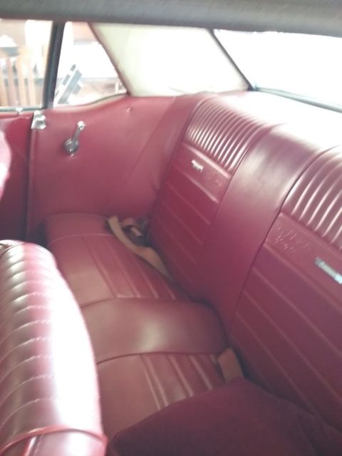 1965 Burgundy Ford Mustang Sedan