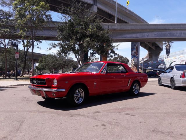 1965 red Ford Mustang