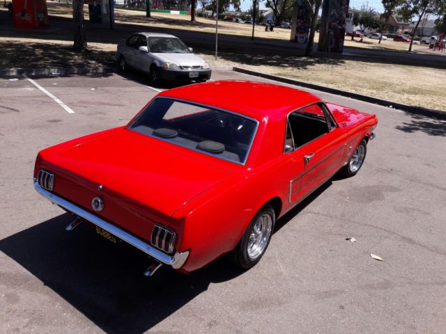 1965 red Ford Mustang