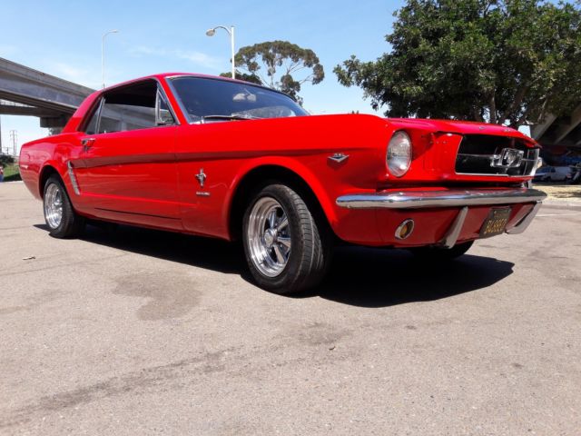 1965 red Ford Mustang