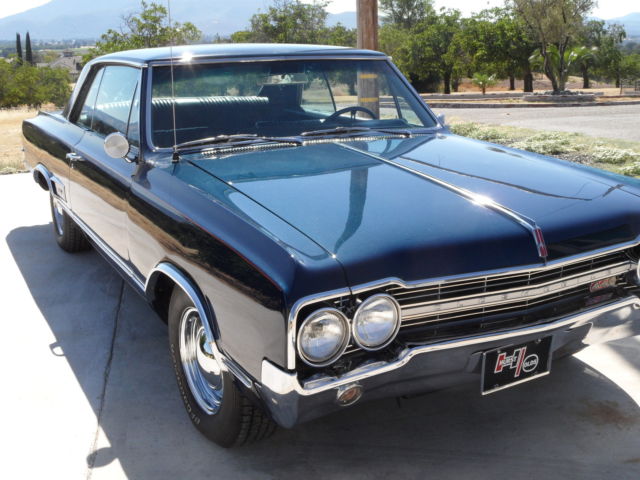 1965 dark blue Oldsmobile 442 Coupe