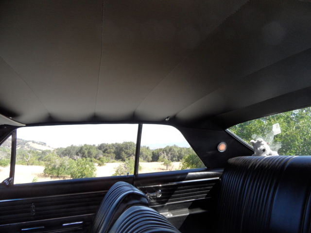 1965 dark blue Oldsmobile 442 Coupe