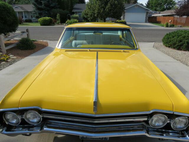 1965 Yellow Oldsmobile 442 Coupe