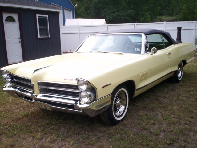 1965 yellow Pontiac 2+2 2 door conv