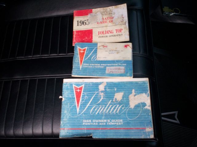 1965 yellow Pontiac 2+2 2 door conv