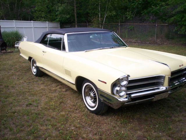 1965 yellow Pontiac 2+2 2 door conv