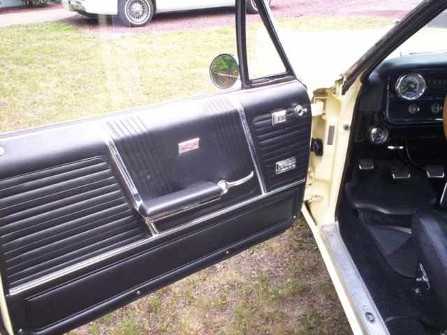 1965 yellow Pontiac 2+2 2 door conv