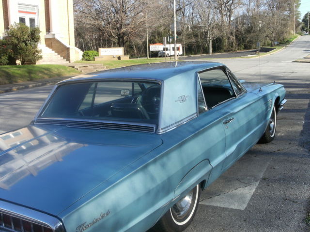 1965 light metalic blue Ford Thunderbird