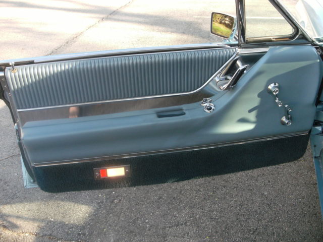 1965 light metalic blue Ford Thunderbird