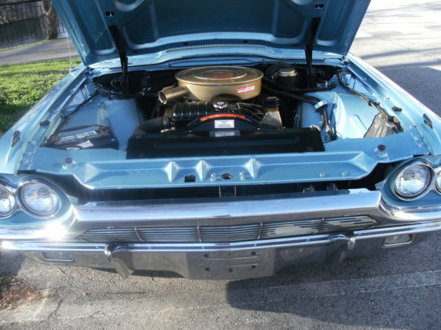 1965 light metalic blue Ford Thunderbird