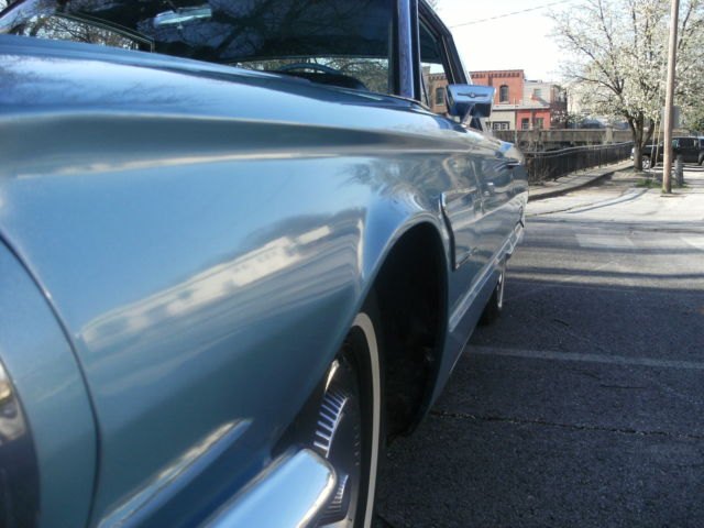 1965 light metalic blue Ford Thunderbird