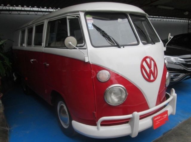 1965 red Volkswagen Beetle - Classic Minivan