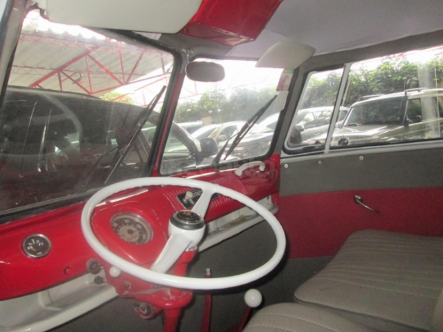 1965 red Volkswagen Beetle - Classic Minivan