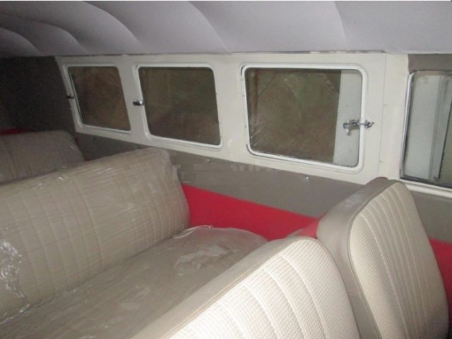 1965 red Volkswagen Beetle - Classic Minivan