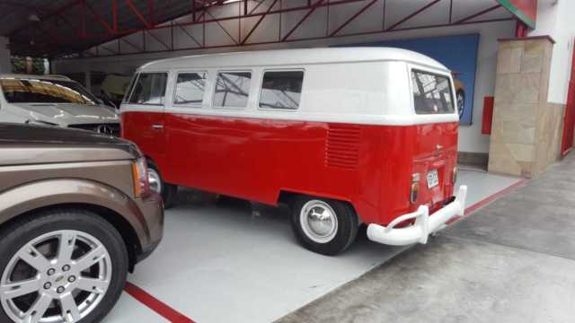 1965 red Volkswagen Beetle - Classic Minivan