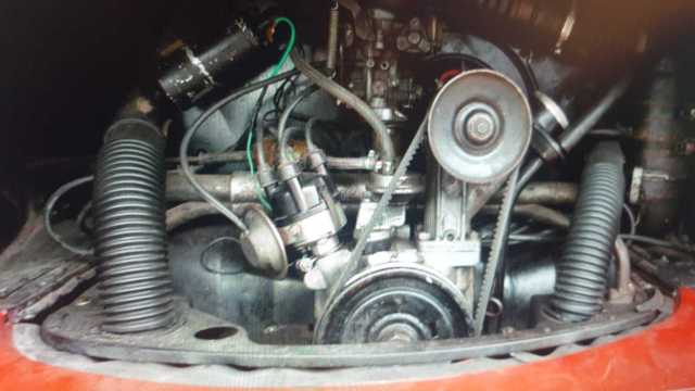 1965 red Volkswagen Beetle - Classic Minivan