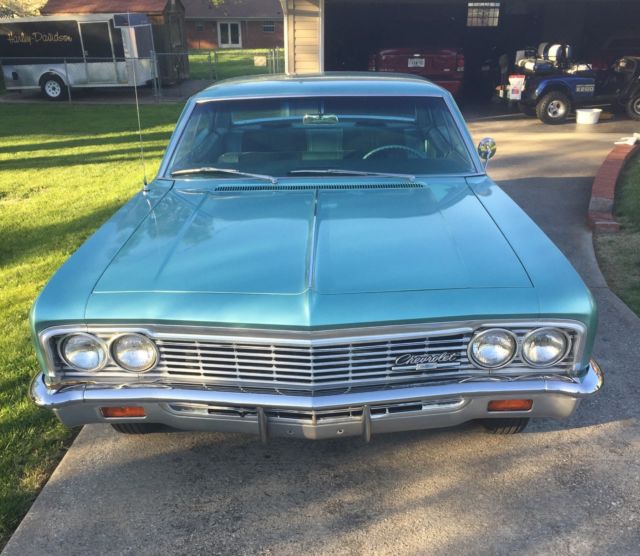 1966 turquoise Chevrolet Impala 4dr hardtop