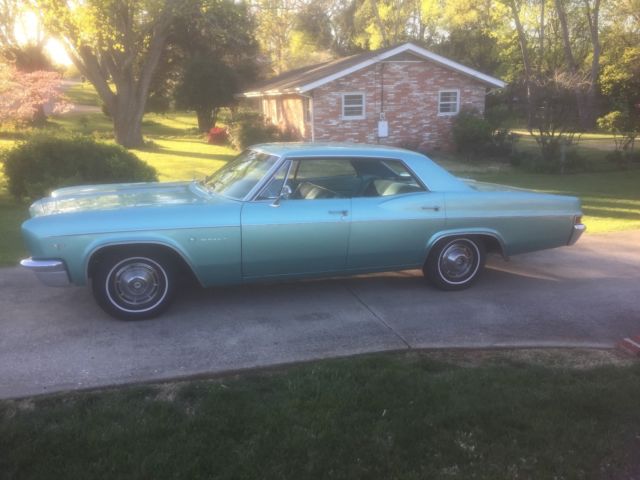1966 turquoise Chevrolet Impala 4dr hardtop
