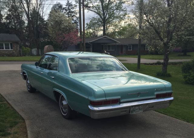 1966 turquoise Chevrolet Impala 4dr hardtop