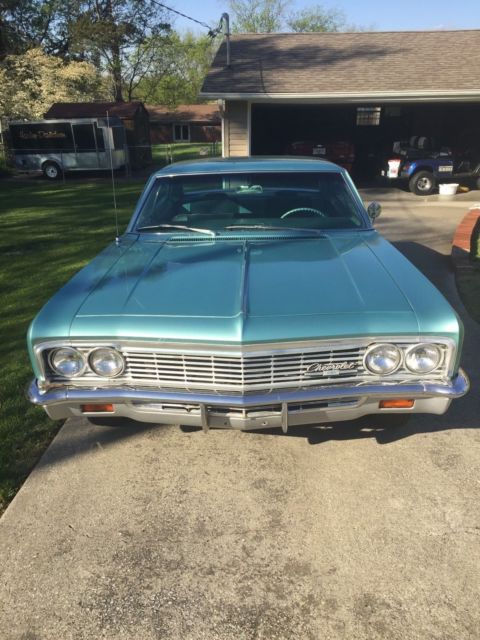 1966 turquoise Chevrolet Impala 4dr hardtop