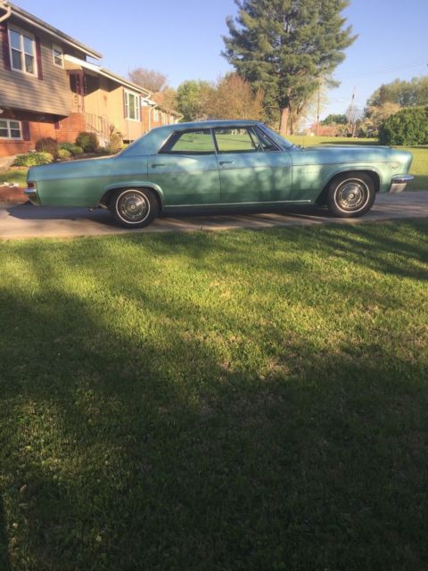 1966 turquoise Chevrolet Impala 4dr hardtop
