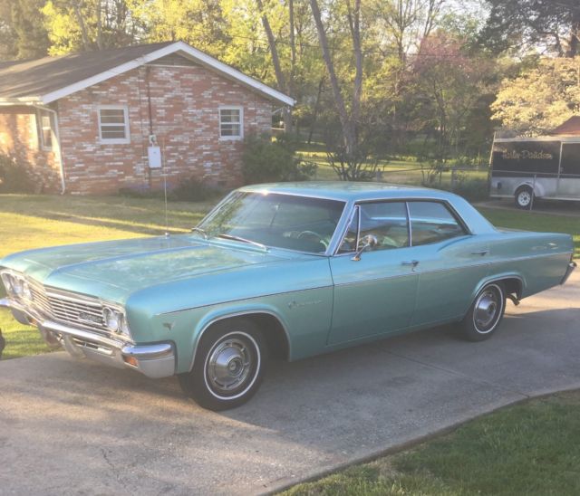1966 turquoise Chevrolet Impala 4dr hardtop