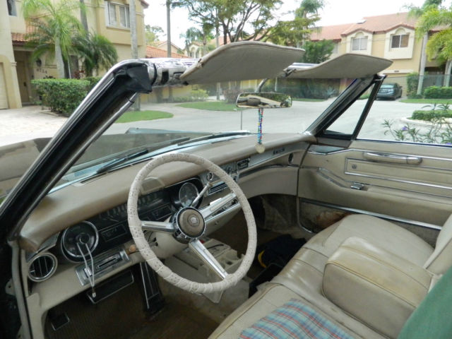 1966 black Cadillac DeVille convertible