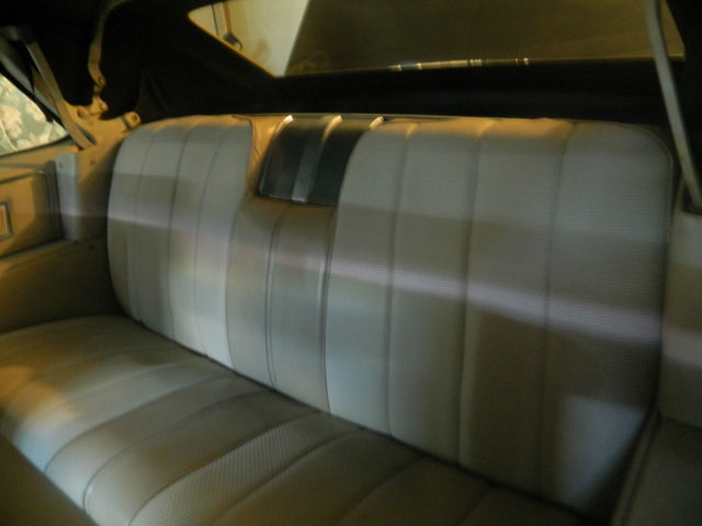 1966 black Cadillac DeVille convertible