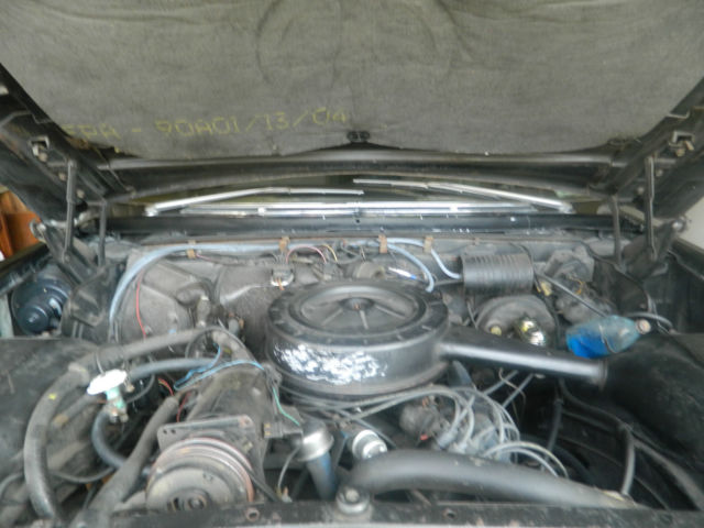 1966 black Cadillac DeVille convertible