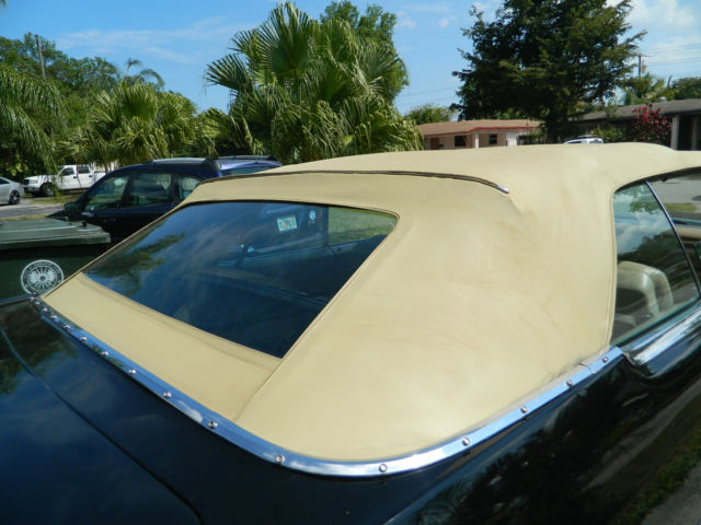 1966 black Cadillac DeVille convertible