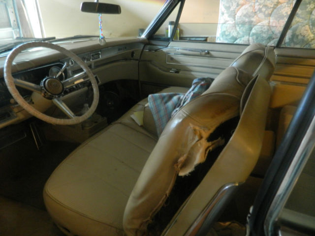 1966 black Cadillac DeVille convertible