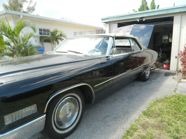 1966 black Cadillac DeVille convertible