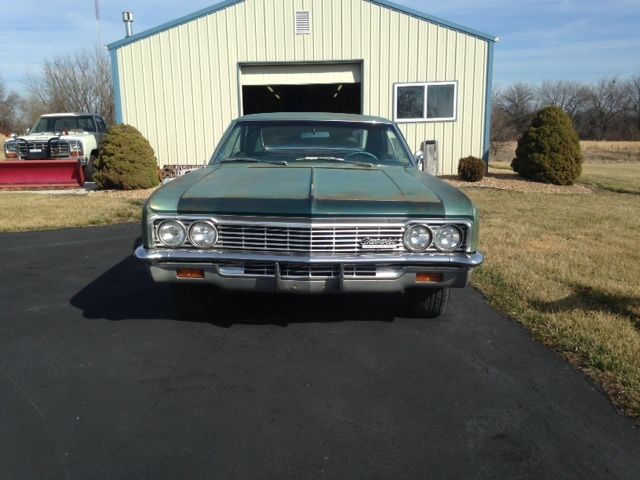 1966 white Chevrolet Impala Coupe