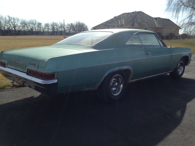 1966 white Chevrolet Impala Coupe