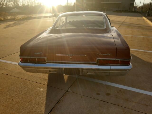 1966 Maroon Chevrolet Impala Coupe