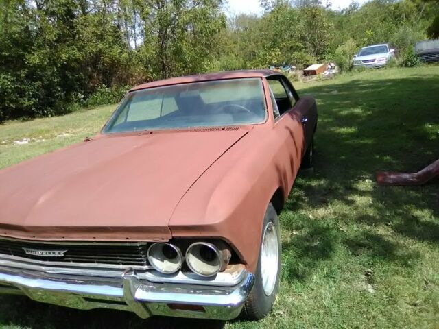 1966 black Chevrolet Chevelle Coupe