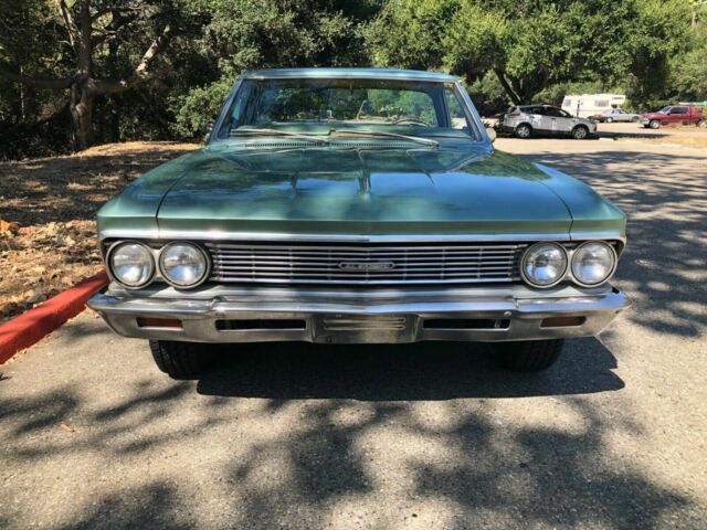1966 green Chevrolet El Camino cab pick up