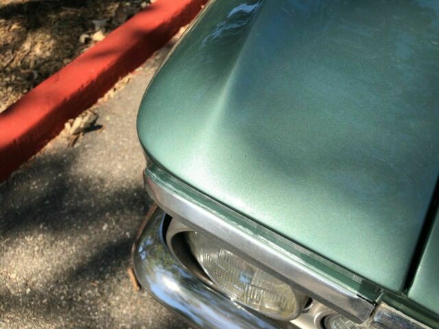 1966 green Chevrolet El Camino cab pick up