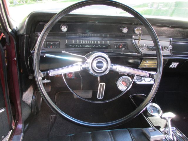 1966 maroon Chevrolet Chevelle Convertible