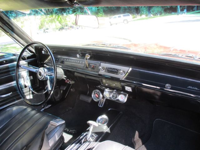 1966 maroon Chevrolet Chevelle Convertible