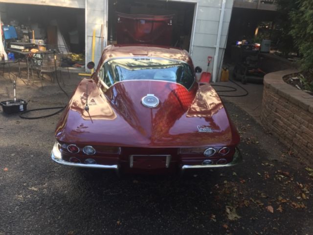 1966 maroon Chevrolet Corvette Coupe