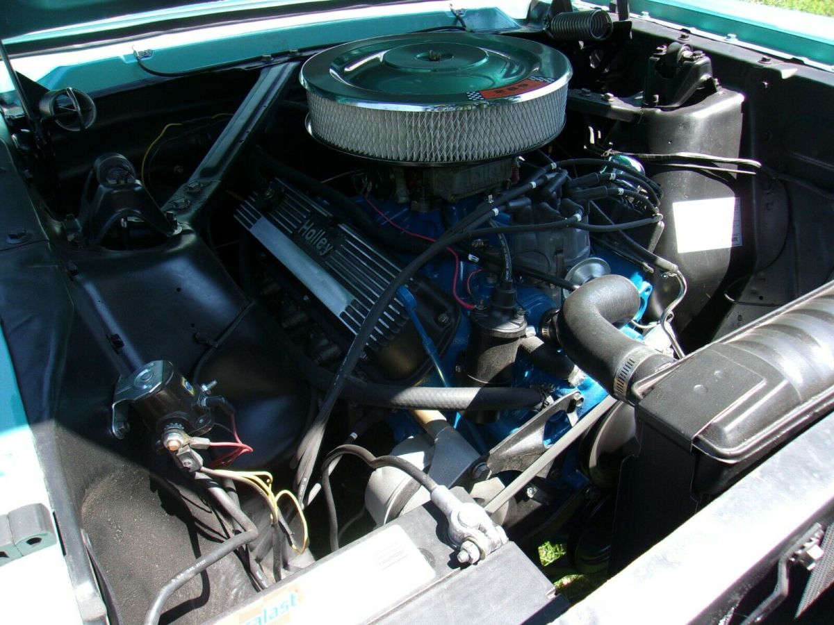 1966 turquoise Ford Mustang