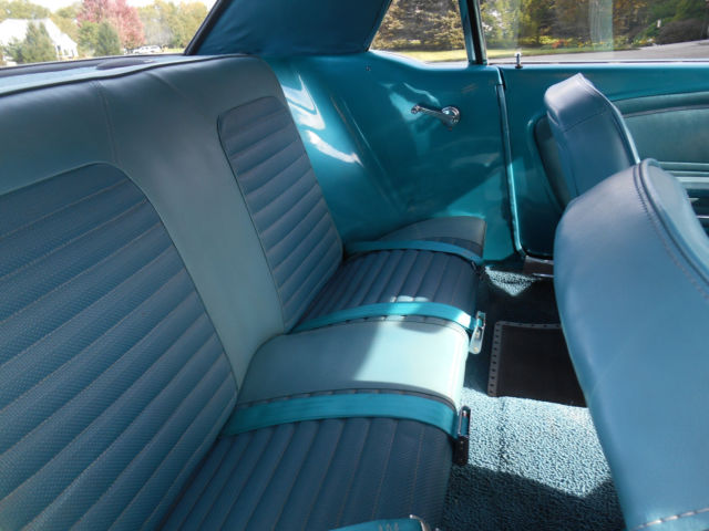 1966 teal Ford Mustang coupe