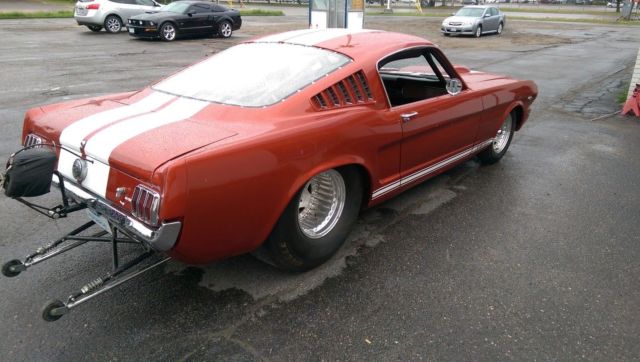 1966 candy apple red Ford Mustang fastback