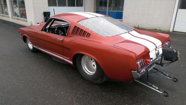 1966 candy apple red Ford Mustang fastback