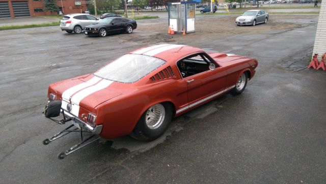 1966 candy apple red Ford Mustang fastback