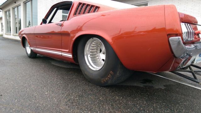 1966 candy apple red Ford Mustang fastback